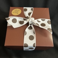 2# Soft Peanut Butter Brittle in a pink and brown box and tied with brown satin ribbon